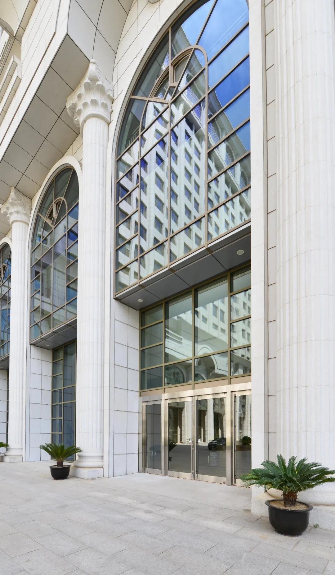 Grand entrance of a public building with glass doors