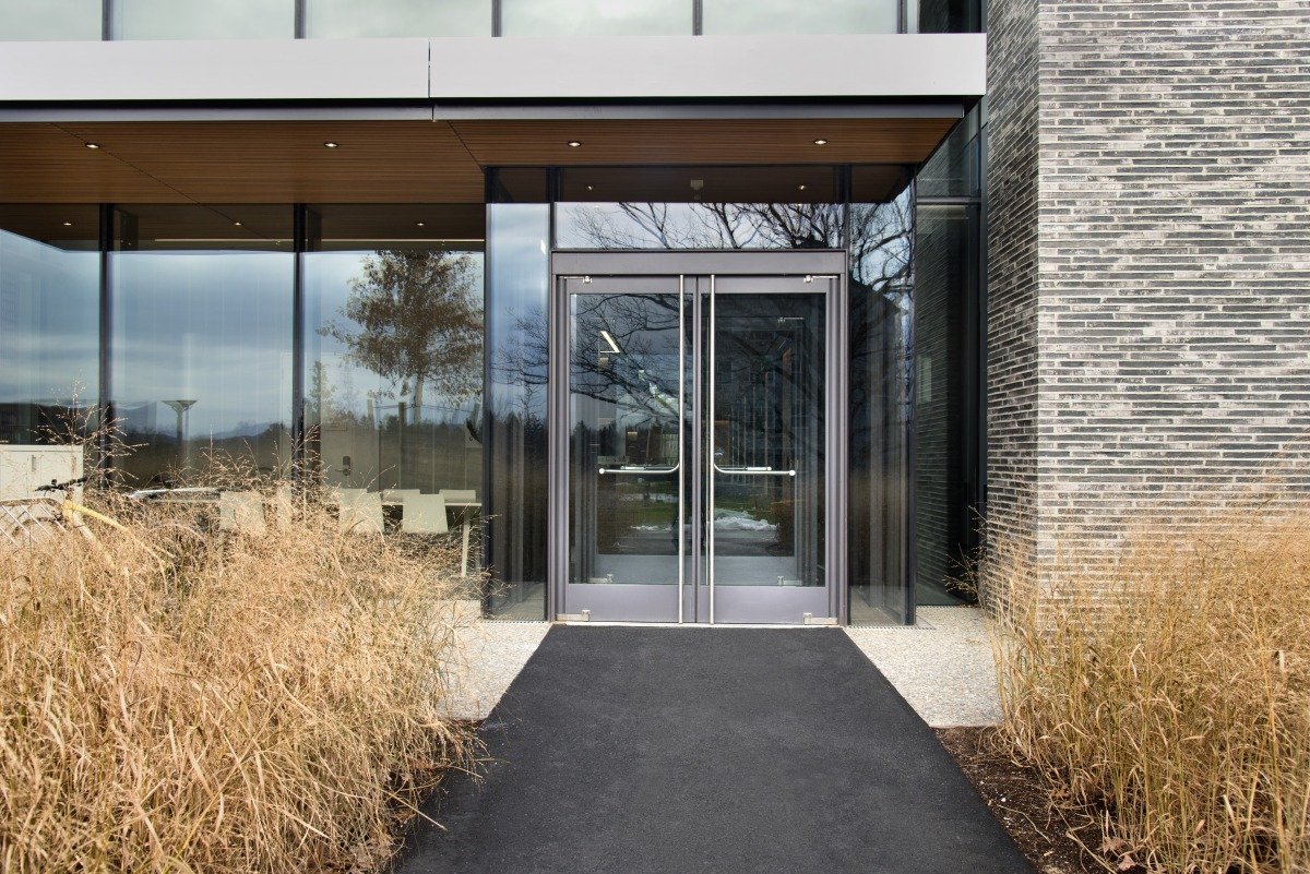 Glass entrance doors at a modern office building